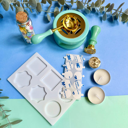 DIY wax sealing kit contents arranged on desk