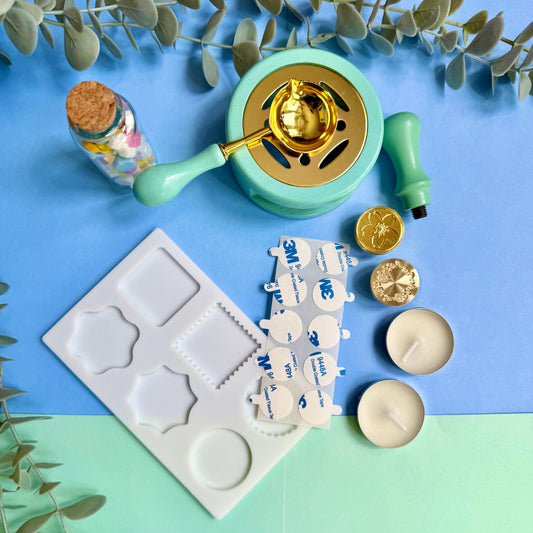 DIY wax sealing kit contents arranged on desk