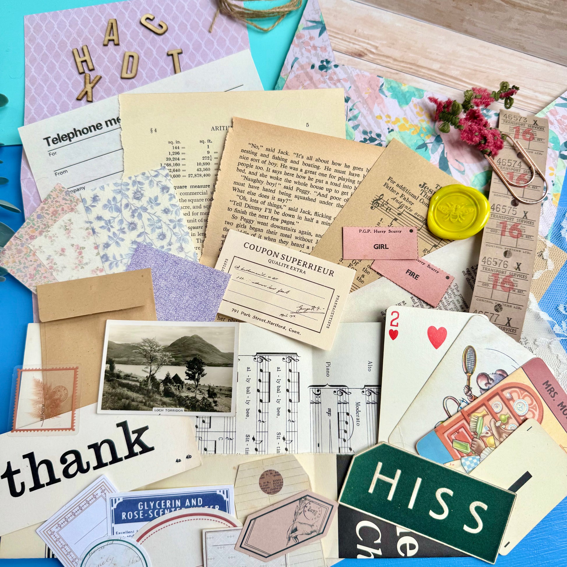 Collection of vintage-style cards and papers with different textures and colors.
