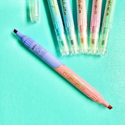Pastel double-ended highlighter uncapped, showing lilac & coral chisel tip