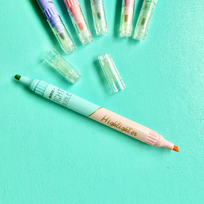 Pastel double-ended highlighter uncapped, showing green & pink chisel tip